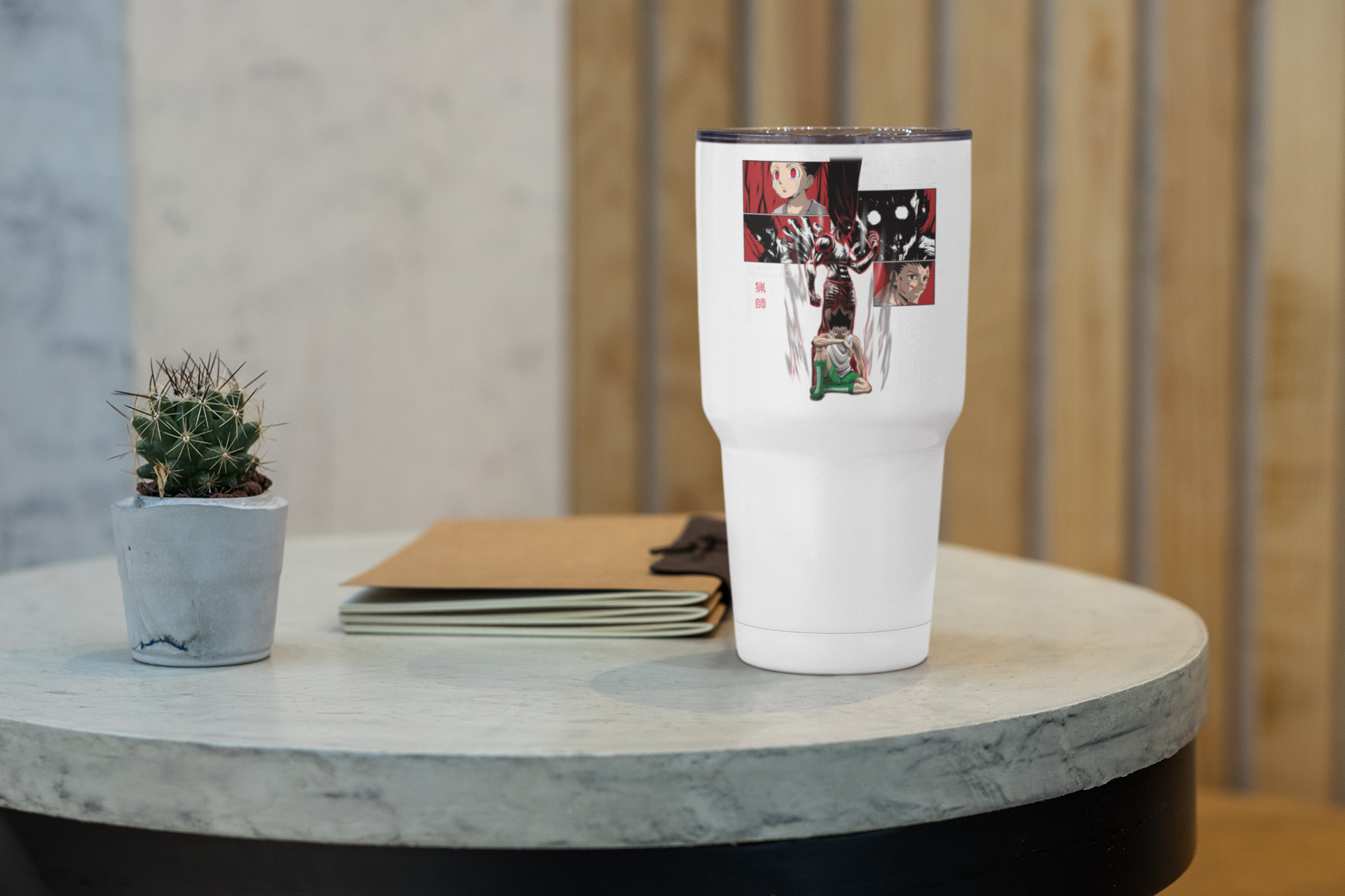a white cup sitting on top of a table next to a plant