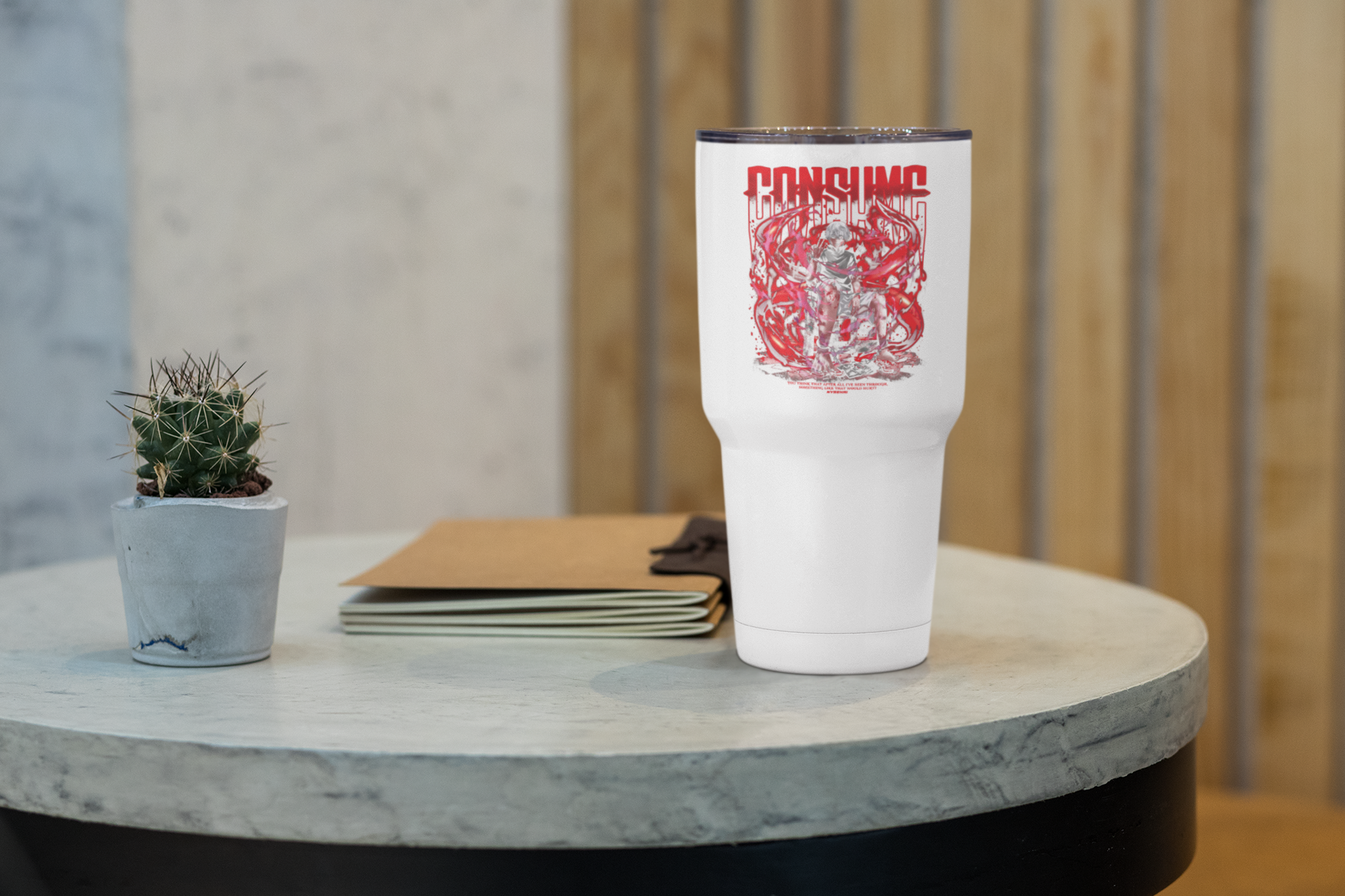 a white coffee cup sitting on top of a table
