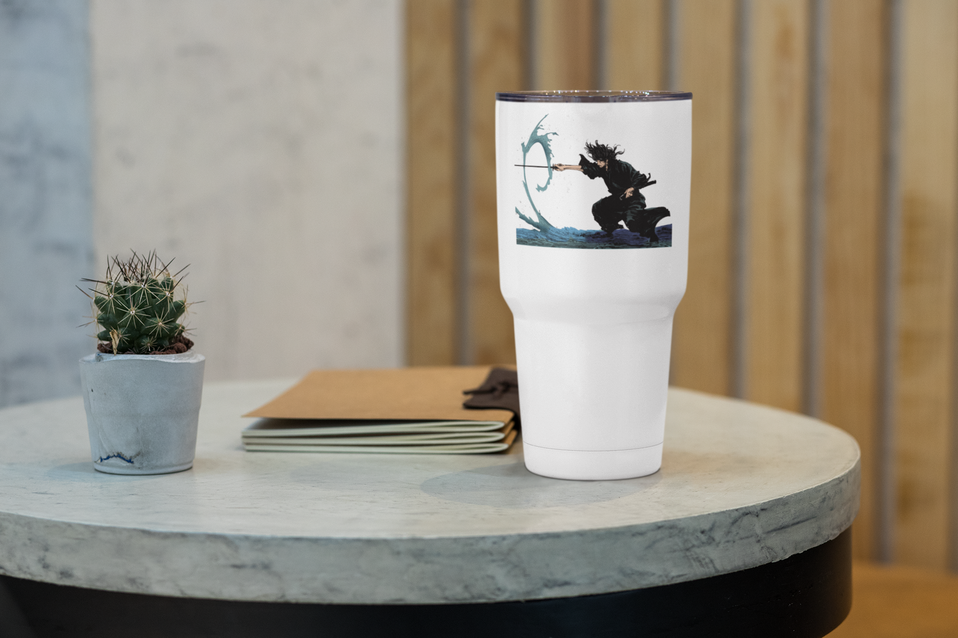 a white coffee cup sitting on top of a table